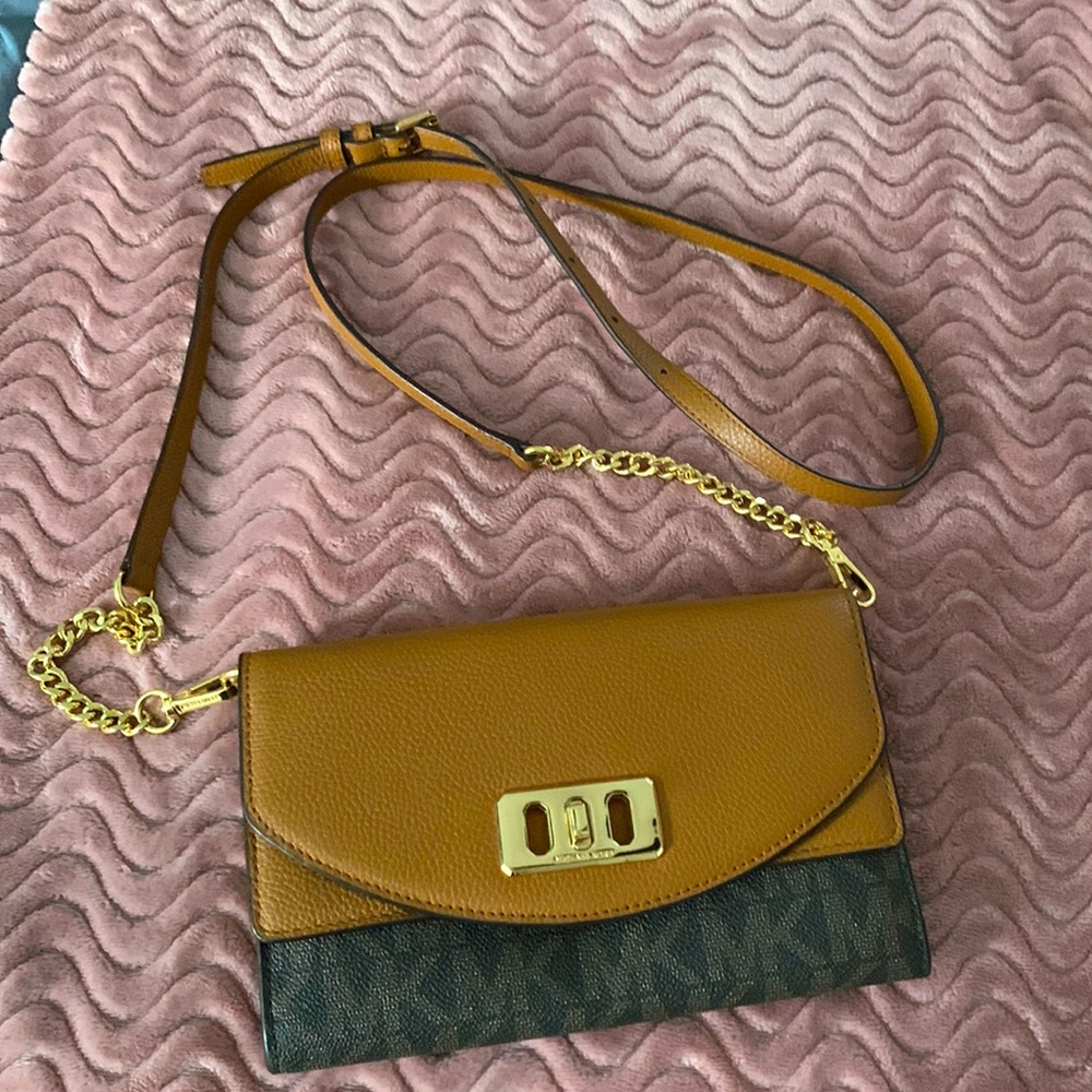 Michael Kors cross body wallet. Brown leather with black signature logo.